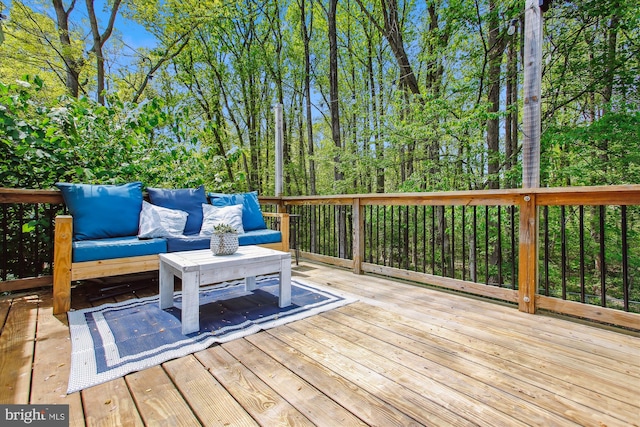 wooden deck featuring an outdoor living space