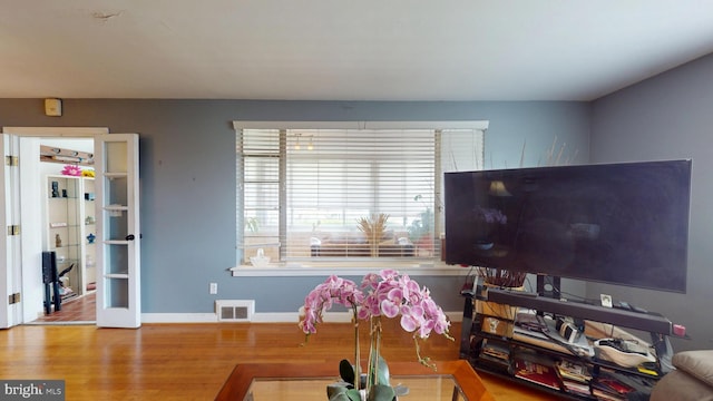 6103 Manor Rd, Clinton, MD 20735 - living area featuring wood finished floors and baseboards
