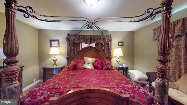 6103 Manor Rd, Clinton, MD 20735 - bedroom with baseboards and wood finished floors
