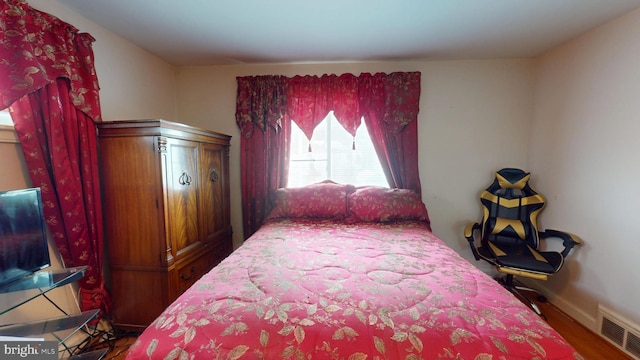 6103 Manor Rd, Clinton, MD 20735 - bedroom with wood finished floors and baseboards