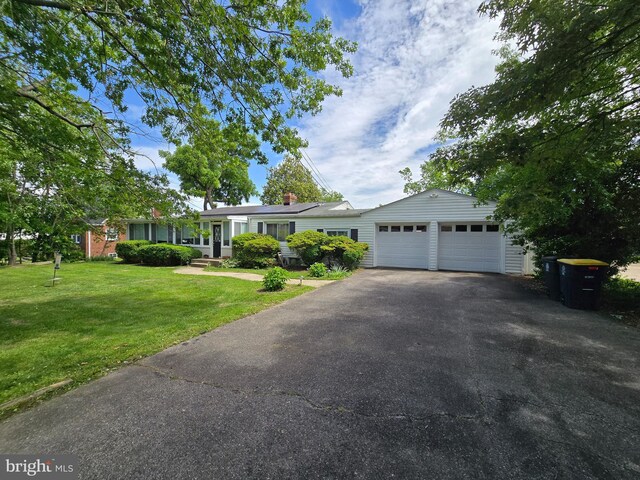 6103 Manor Rd, Clinton, MD 20735 - single story home with asphalt driveway, a front lawn, and a garage