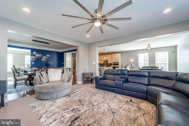 living room featuring recessed lighting, plenty of natural light, light wood-type flooring, and ceiling fan