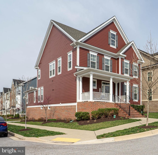 view of front of house featuring a residential view and covered porch