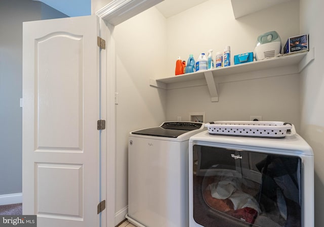 laundry area with washer and dryer, laundry area, and baseboards