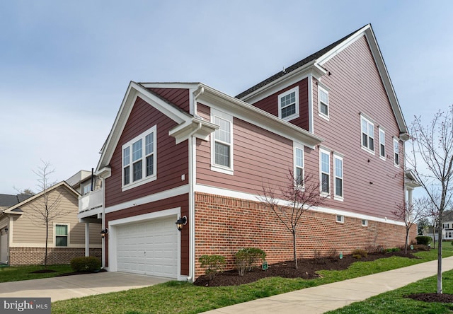 view of home's exterior featuring a garage and driveway