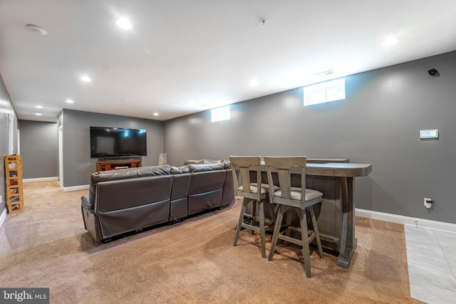 living area with recessed lighting, baseboards, and a dry bar