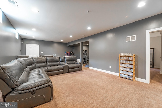 living room with visible vents, baseboards, recessed lighting, and carpet flooring