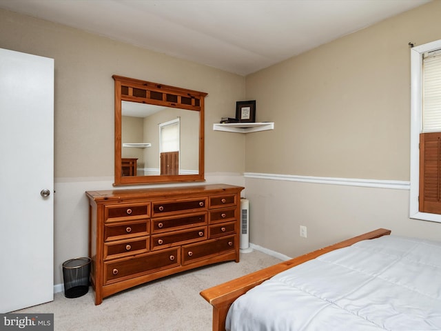 bedroom with light carpet