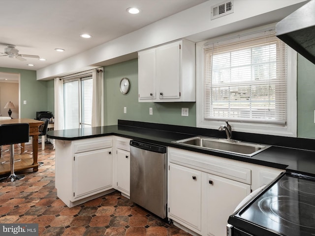 kitchen featuring black / electric stove, a peninsula, visible vents, stainless steel dishwasher, and a sink