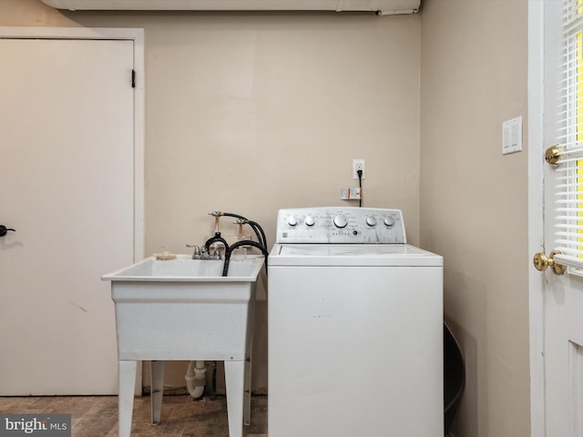 laundry area featuring washer / clothes dryer and laundry area