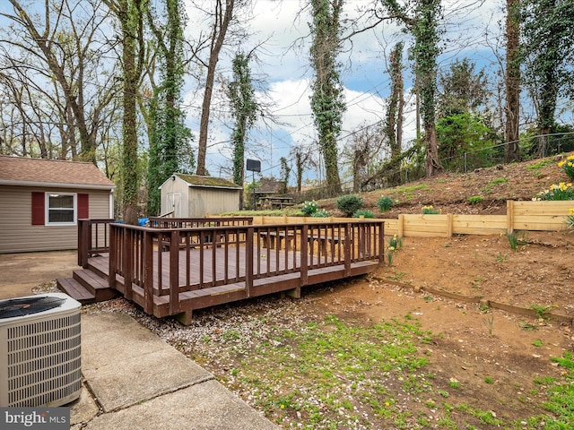 wooden terrace with central AC, a garden, a storage shed, an outdoor structure, and fence private yard