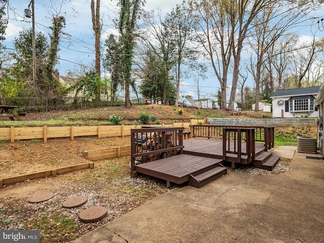 wooden deck featuring fence and central air condition unit