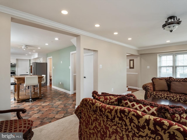 living room with crown molding, baseboards, and recessed lighting