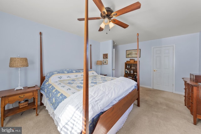 bedroom featuring a ceiling fan and light carpet