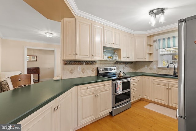 kitchen featuring crown molding, dark countertops, open shelves, a sink, and stainless steel appliances