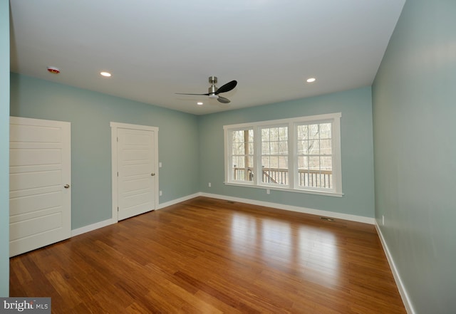 unfurnished room with recessed lighting, baseboards, a ceiling fan, and wood finished floors
