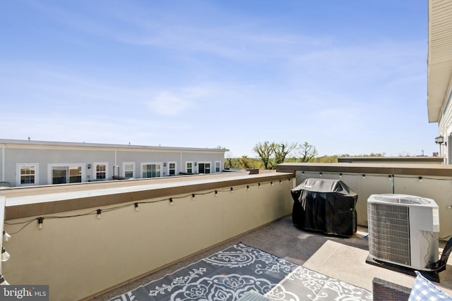 balcony featuring grilling area and central air condition unit