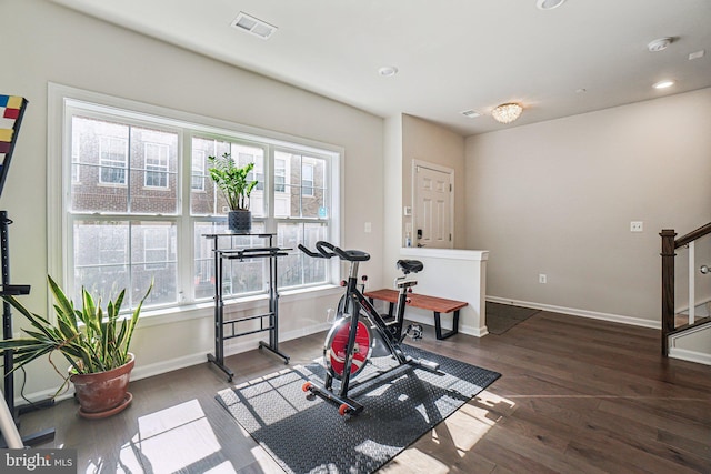 workout room featuring recessed lighting, visible vents, baseboards, and wood finished floors
