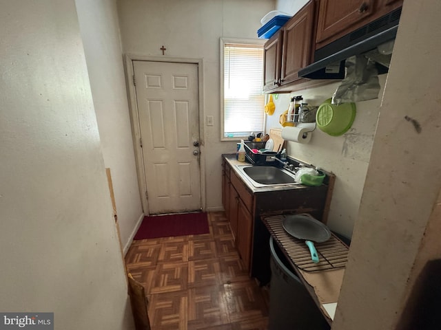 5259 N 5th St, Philadelphia, PA 19120 - kitchen with brown cabinetry, a sink, and light countertops