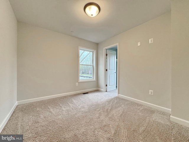 9871 La Plata Pkwy, La Plata, MD 20646 - unfurnished room with carpet floors, baseboards, and visible vents