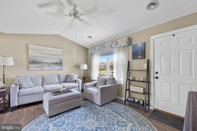 living room with wood finished floors, visible vents, a ceiling fan, and lofted ceiling