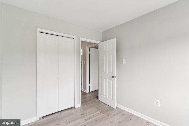4647 6th St SE, Washington, DC 20032 - unfurnished bedroom featuring light wood-style flooring and a closet