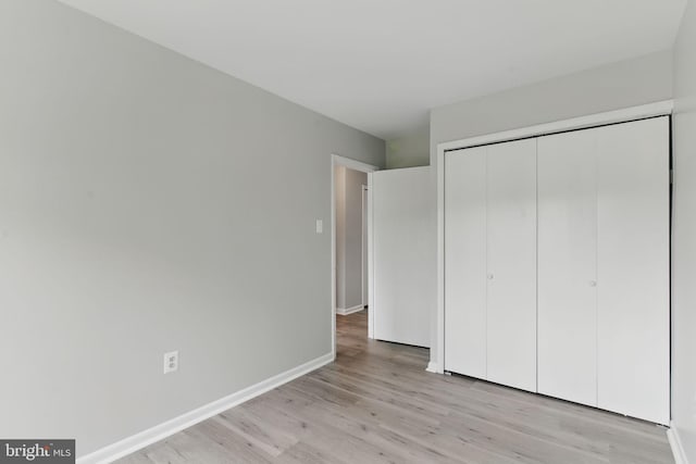 4647 6th St SE, Washington, DC 20032 - unfurnished bedroom with light wood finished floors and a closet