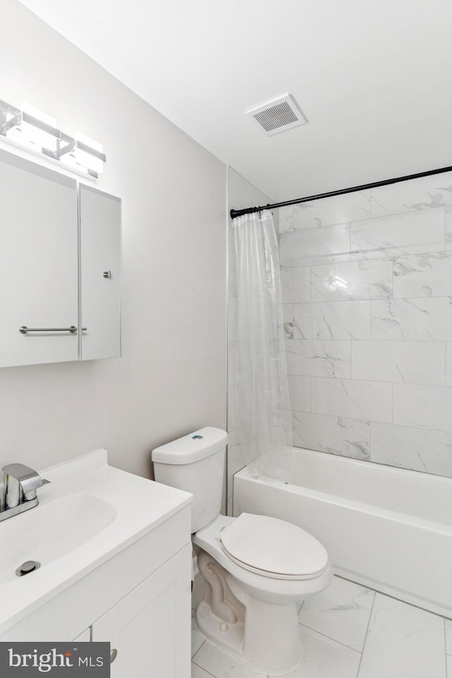 4647 6th St SE, Washington, DC 20032 - bathroom featuring vanity, marble finish floors, and shower / bath combo