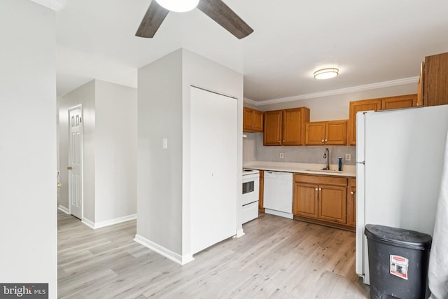4647 6th St SE, Washington, DC 20032 - kitchen featuring white appliances, light wood-type flooring, ceiling fan, and brown cabinetry