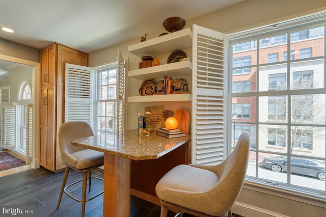 dining area featuring dark wood-style flooring