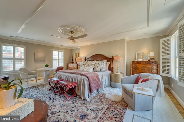 bedroom with crown molding, baseboards, and ceiling fan