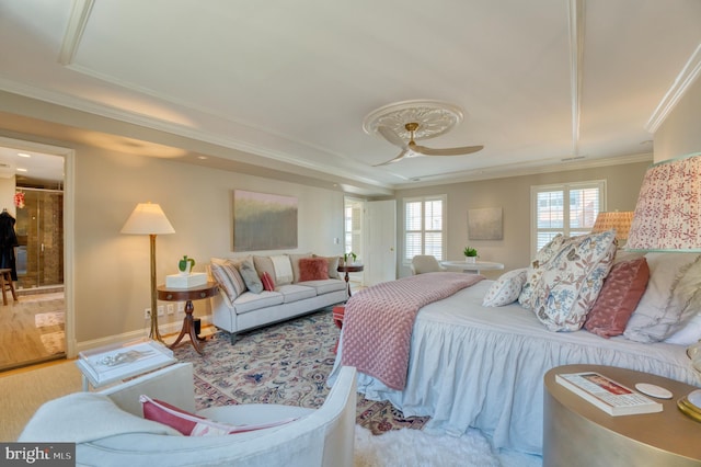 bedroom with ceiling fan, ornamental molding, and a closet