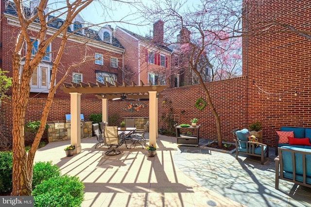 view of patio with an outdoor living space, a pergola, and outdoor dining space
