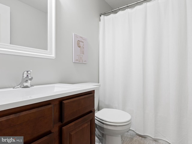full bath with vanity and toilet