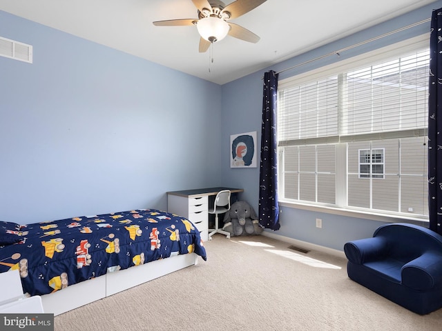 bedroom with carpet floors, visible vents, a ceiling fan, and baseboards