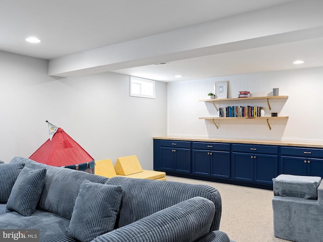 living area with recessed lighting and light colored carpet