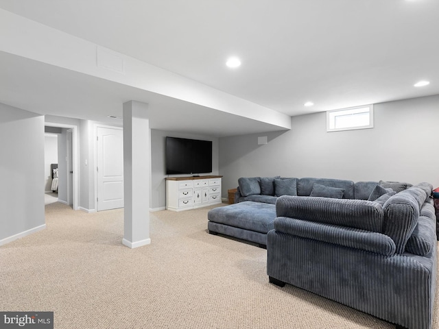 carpeted living room with recessed lighting and baseboards