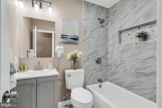 bathroom with tub / shower combination, toilet, and vanity