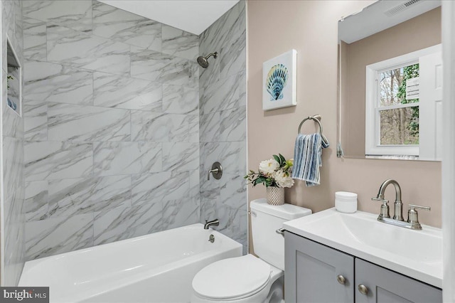 full bathroom featuring visible vents,  shower combination, toilet, and vanity