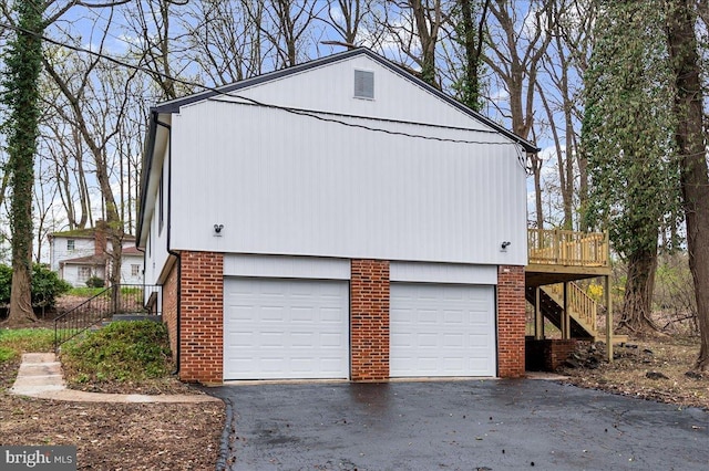 garage featuring driveway