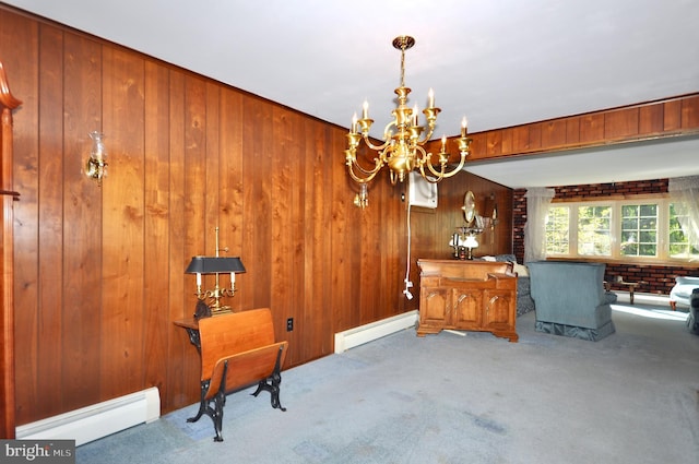 dining space with an inviting chandelier, baseboard heating, carpet, and wood walls