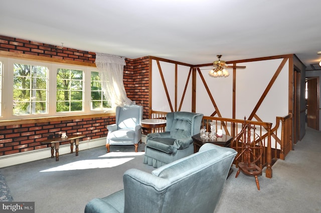 carpeted living room featuring a ceiling fan and brick wall