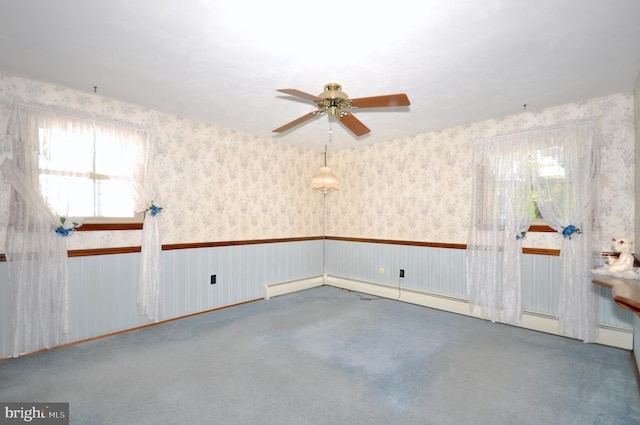 unfurnished room featuring carpet flooring, ceiling fan, and wallpapered walls
