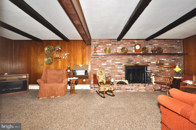 living room with carpet floors, baseboard heating, wooden walls, and beamed ceiling
