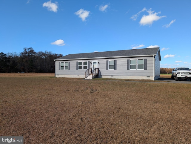 12475 Staytonville Rd, Harrington, DE 19952 - view of front of home with a shingled roof, a front lawn, and crawl space