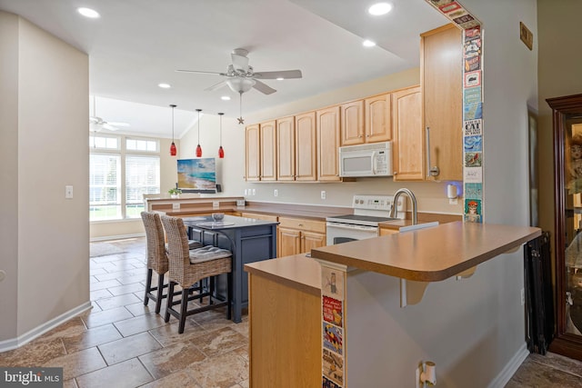 37959 Bayview Cir E, Selbyville, DE 19975 - kitchen with white appliances, light brown cabinetry, a peninsula, and ceiling fan