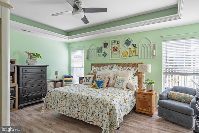 37959 Bayview Cir E, Selbyville, DE 19975 - bedroom with visible vents, a ceiling fan, and wood finished floors