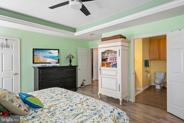 37959 Bayview Cir E, Selbyville, DE 19975 - bedroom featuring baseboards, a ceiling fan, ensuite bath, and wood finished floors