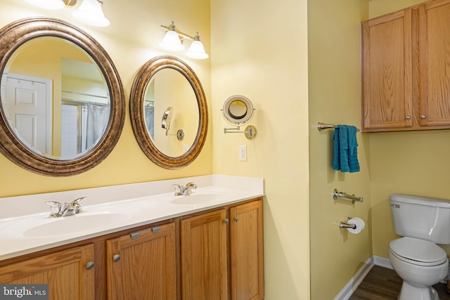 37959 Bayview Cir E, Selbyville, DE 19975 - full bathroom with a sink, toilet, double vanity, and baseboards