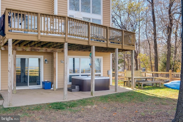 119 Bald Eagle Dr, Montross, VA 22520 - back of property featuring a hot tub, a patio area, and a deck